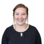 Headshot of a smiling woman with a black blouse.