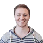 Headshot of a cheerful man in striped hoodie, clear background.