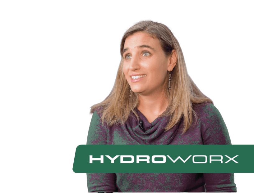 Woman in purple, looking right, HYDROWORX logo below.