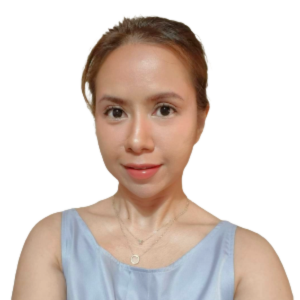 a woman is wearing a blue tank top and a necklace .