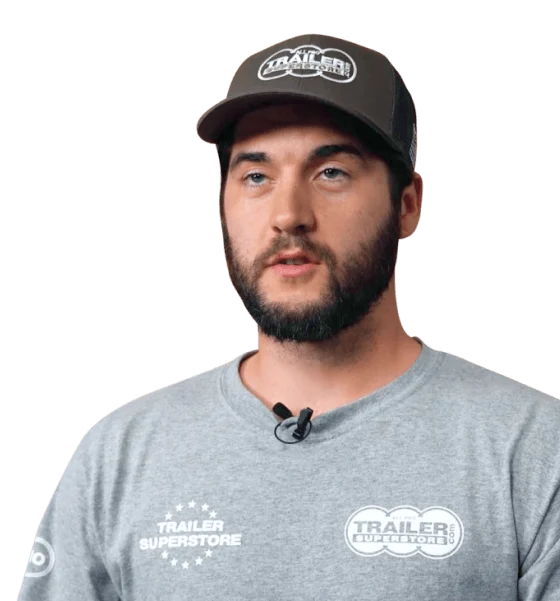 a man wearing a hat and a trailer superstore shirt
