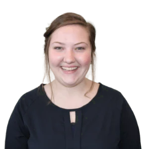 Headshot of a smiling woman with a black blouse.