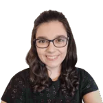 Headshot of smiling woman with black-framed glasses and brunette hair.