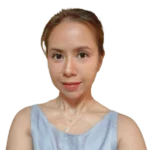 a woman is wearing a blue tank top and a necklace .